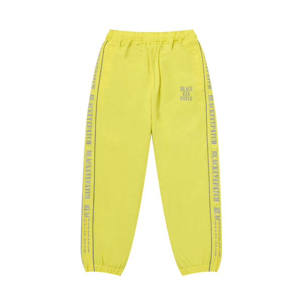 REFLECTIVE STENCIL LOGO TRACK PANTS YELLOW