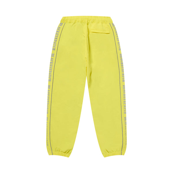 REFLECTIVE STENCIL LOGO TRACK PANTS YELLOW