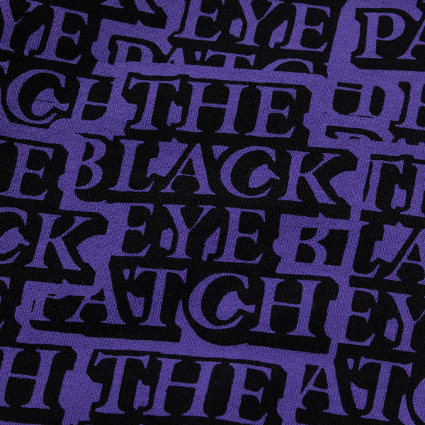 Purple Crew Sweatshirt Covered in Stickers